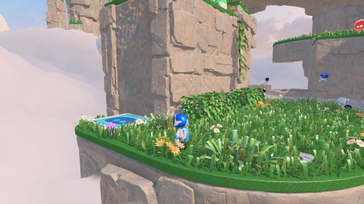 Gehen Sie zurück ins Gras und finden Sie das blaue Trampolin, das Sie zum nächsten Level bringt - Astros Playroom: Gusty Gateway - Komplettlösung - Wiese der Erinnerung - Astros Playroom Guide