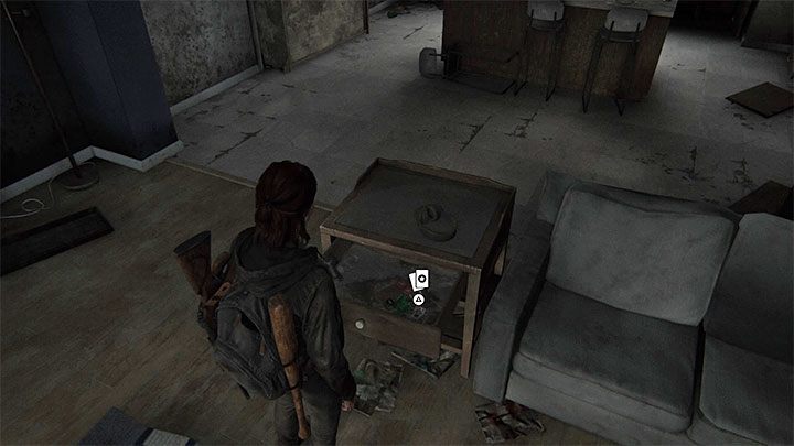 Secret is hidden in the drawer of a cupboard next to the couch - The Last of Us 2: Capitol Hill - collectibles, artefacts, coins - Seattle Day 1 - Ellie - The Last of Us 2 Guide