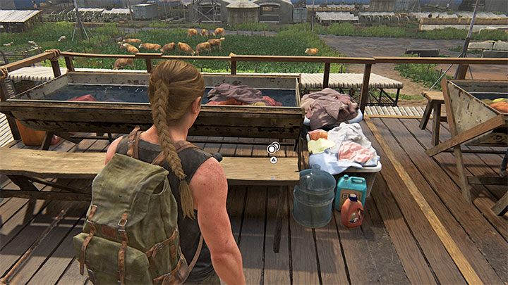 Die Münze liegt auf einer der langen Holzbänke – The Last of Us 2: The Stadium – Sammlerstücke, Artefakte, Münzen – Seattle Tag 1 – Abby – The Last of Us 2 Guide