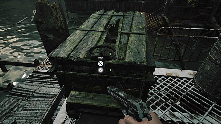 Ethan gelangt zu einem größeren Gebäude und hier müssen Sie die im Bild gezeigte Kutsche schieben – Resident Evil Village: Durch den Stausee gehen, den Fischen ausweichen – Komplettlösung – Festung – Resident Evil Village Guide