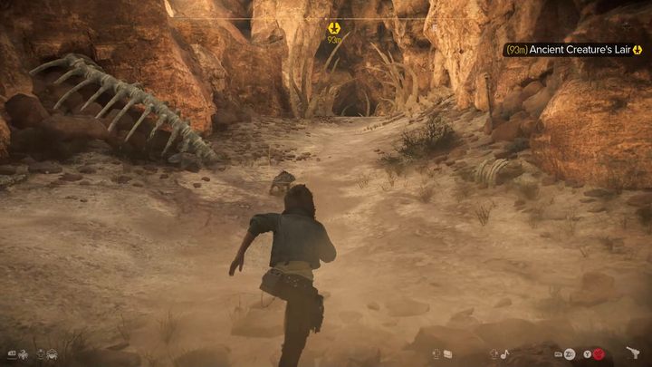 Sie können die Höhle an den Knochen erkennen, die um ihren Eingang verstreut sind - Star Wars Outlaws: The Heavy - Komplettlösung - Tatooine - Star Wars Outlaws Guide