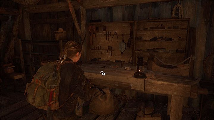 Die Inselbühne In einer der Hütten des Kultordorfes befindet sich ein Werkbank-Tisch - The Last of Us 2: Upgrades für Werkbänke und Waffen - Charakterentwicklung und Ausrüstungs-Upgrades - The Last of Us 2 Guide
