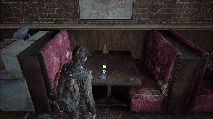 Die Broschüre befindet sich auf einem der Tische im Essbereich der Spielhalle - The Last of Us 2: Die überflutete Stadt - Sammlerstücke, Artefakte, Münzen - Seattle, Tag 3 - Ellie - The Last of Us 2 Guide