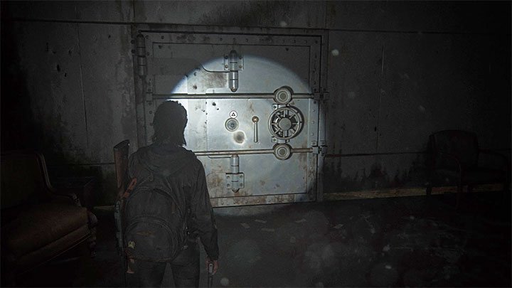 Ein verschlossener Eingang zum Tresor befindet sich in einem Raum auf der Rückseite der Bank - The Last of Us 2: Sichere Kombinationen - Seattle, Tag 1 Ellie - Safes - The Last of Us 2 Guide